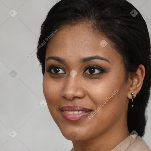 Joyful black young-adult female with medium  brown hair and brown eyes