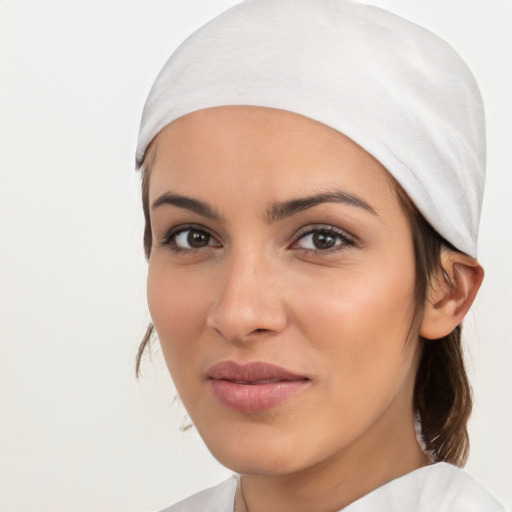 Joyful white young-adult female with medium  black hair and brown eyes