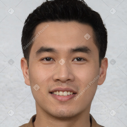 Joyful white young-adult male with short  black hair and brown eyes