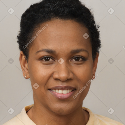 Joyful black young-adult female with short  brown hair and brown eyes