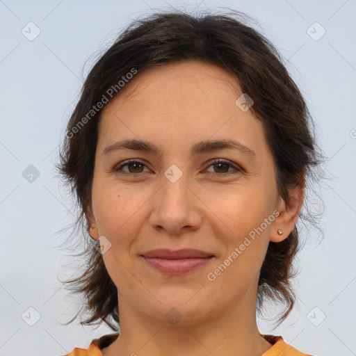 Joyful white adult female with medium  brown hair and brown eyes