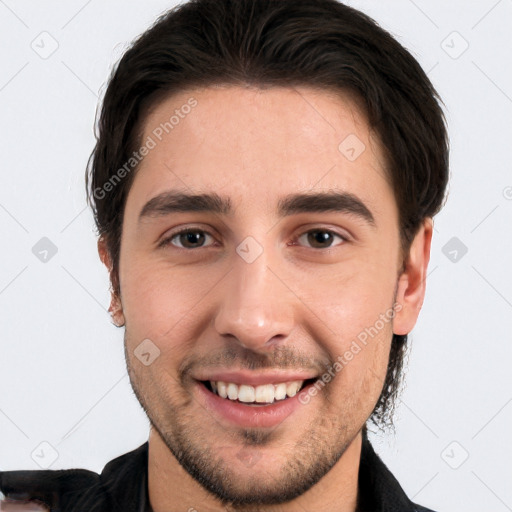 Joyful white young-adult male with short  black hair and brown eyes