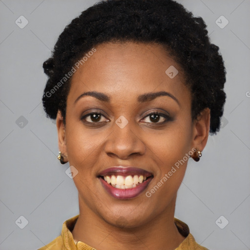 Joyful black young-adult female with long  black hair and brown eyes