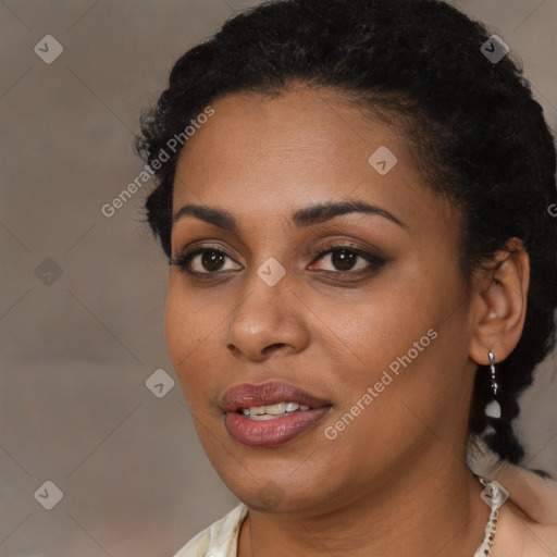 Joyful black young-adult female with short  black hair and brown eyes