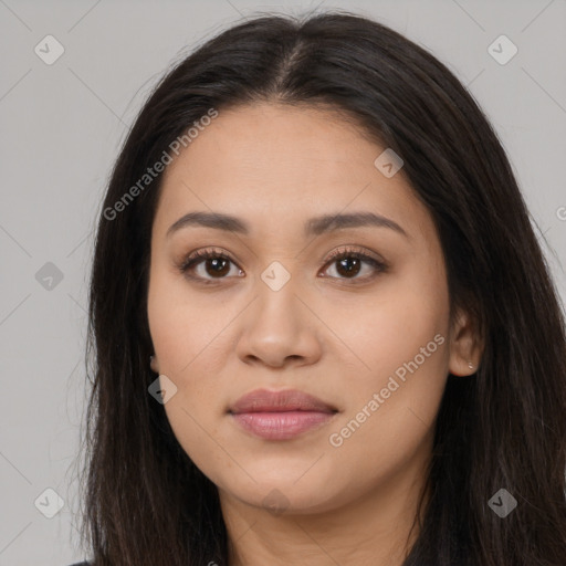 Joyful latino young-adult female with long  brown hair and brown eyes