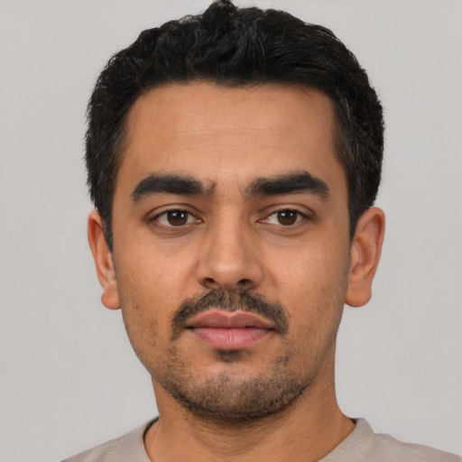 Neutral latino young-adult male with short  black hair and brown eyes