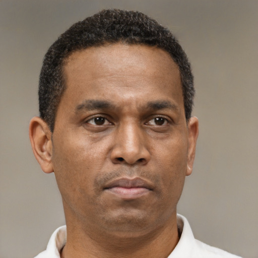 Neutral latino adult male with short  brown hair and brown eyes