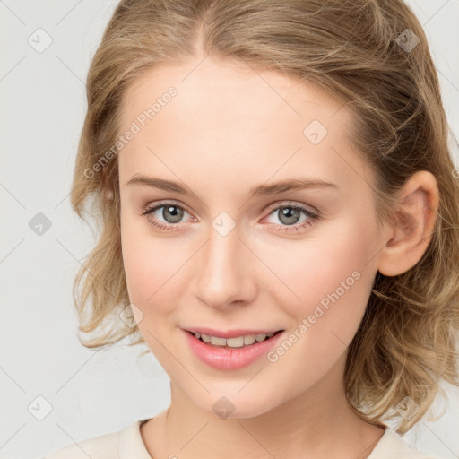 Joyful white young-adult female with medium  brown hair and blue eyes