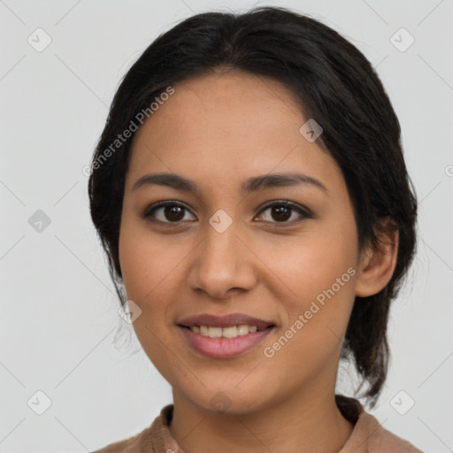 Joyful latino young-adult female with medium  brown hair and brown eyes