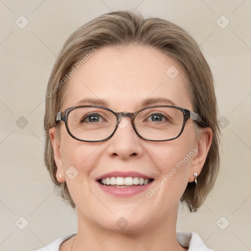 Joyful white adult female with medium  brown hair and blue eyes