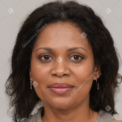 Joyful black adult female with medium  brown hair and brown eyes