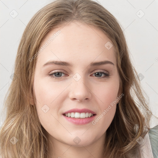 Joyful white young-adult female with long  brown hair and green eyes