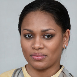 Joyful latino young-adult female with short  brown hair and brown eyes