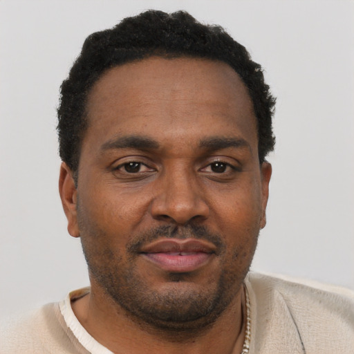 Neutral black young-adult male with short  brown hair and brown eyes