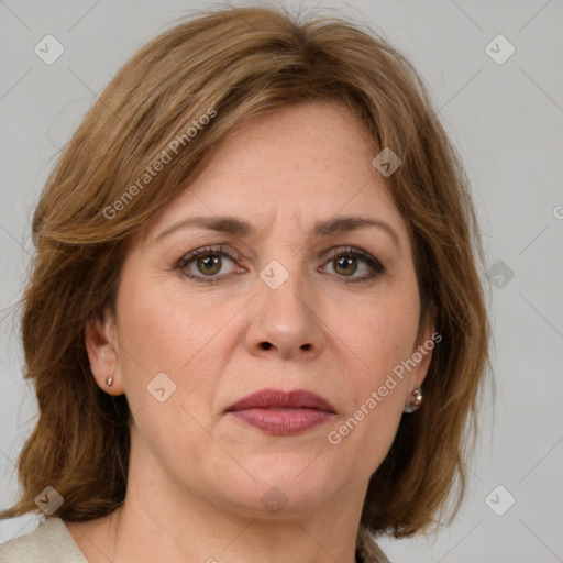 Joyful white adult female with medium  brown hair and grey eyes