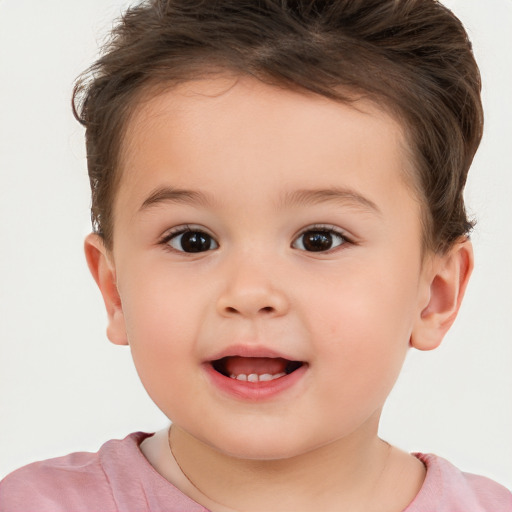 Joyful white child male with short  brown hair and brown eyes