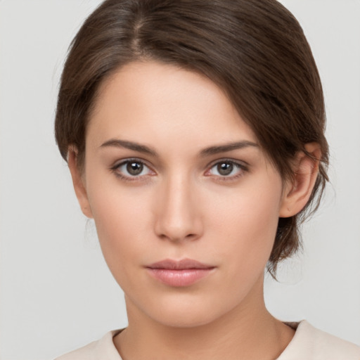 Neutral white young-adult female with medium  brown hair and brown eyes