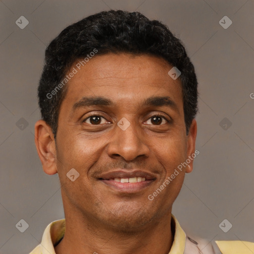 Joyful latino adult male with short  black hair and brown eyes