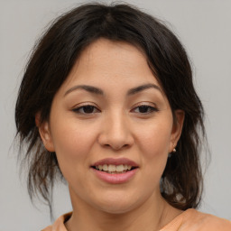 Joyful asian young-adult female with medium  brown hair and brown eyes