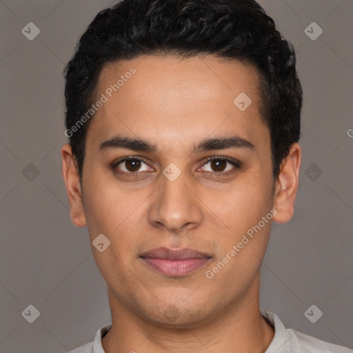 Joyful latino young-adult male with short  black hair and brown eyes