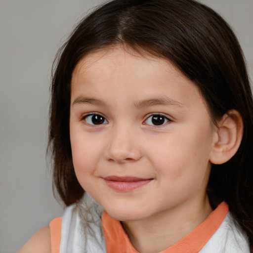 Joyful white child female with medium  brown hair and brown eyes