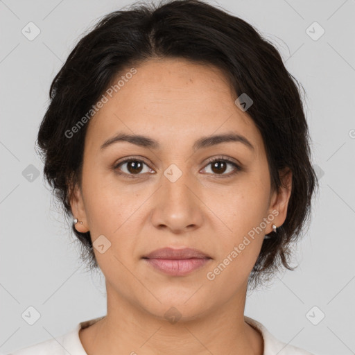 Joyful latino young-adult female with medium  brown hair and brown eyes