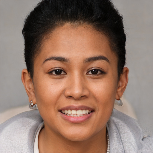 Joyful white young-adult female with short  brown hair and brown eyes