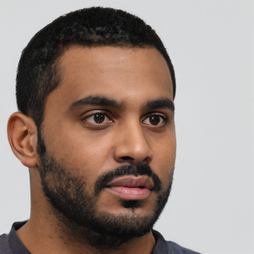 Neutral black young-adult male with short  black hair and brown eyes