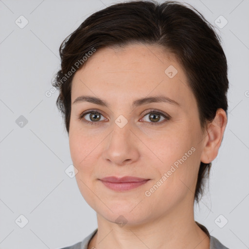 Joyful white young-adult female with medium  brown hair and brown eyes