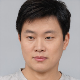 Neutral asian young-adult male with short  black hair and brown eyes