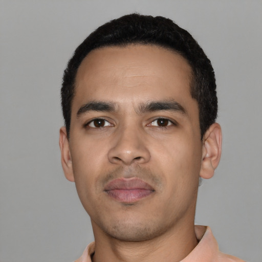 Neutral latino young-adult male with short  black hair and brown eyes