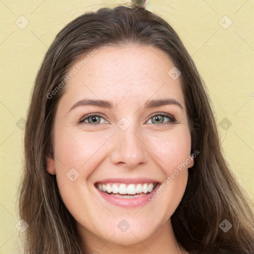 Joyful white young-adult female with long  brown hair and green eyes