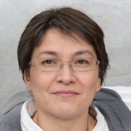 Joyful white adult female with short  brown hair and brown eyes