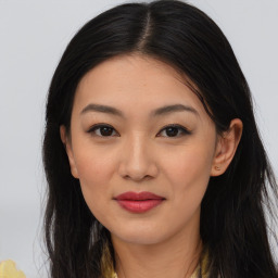 Joyful asian young-adult female with long  brown hair and brown eyes