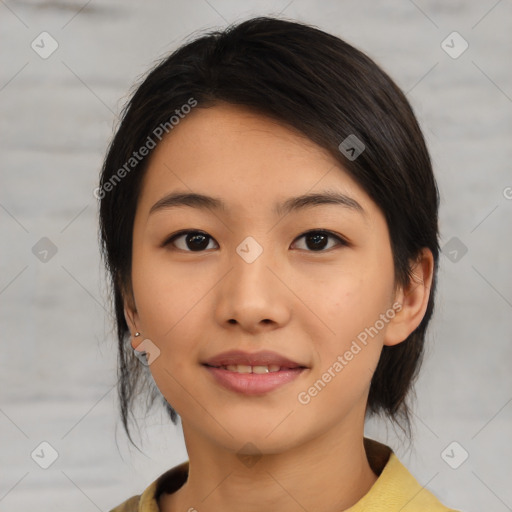 Joyful asian young-adult female with medium  black hair and brown eyes