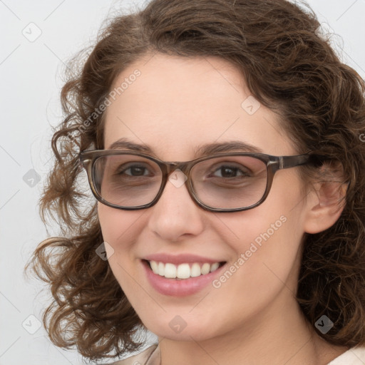 Joyful white young-adult female with medium  brown hair and blue eyes