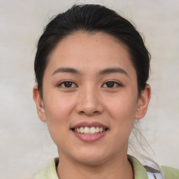 Joyful asian young-adult female with short  brown hair and brown eyes