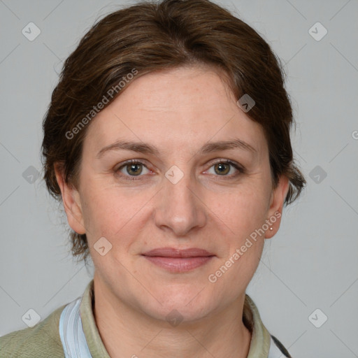 Joyful white adult female with short  brown hair and grey eyes