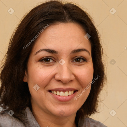 Joyful white adult female with long  brown hair and brown eyes