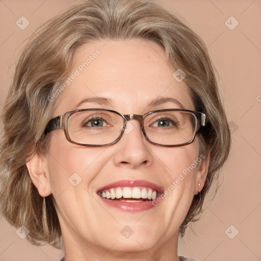 Joyful white adult female with medium  brown hair and blue eyes