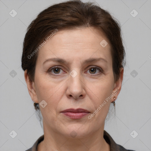 Joyful white adult female with short  brown hair and brown eyes