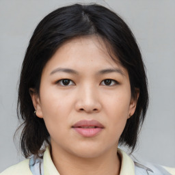 Neutral asian young-adult female with medium  brown hair and brown eyes