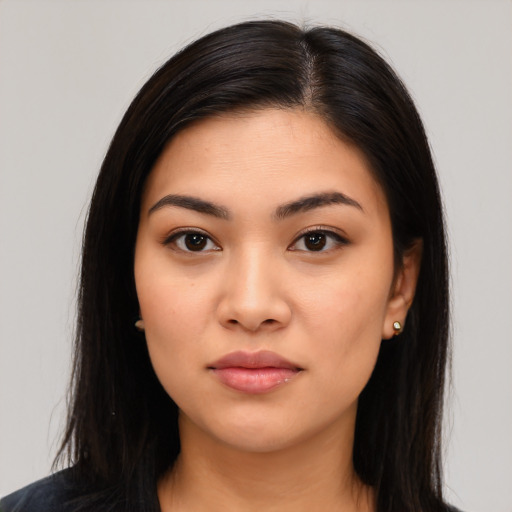 Joyful asian young-adult female with long  black hair and brown eyes