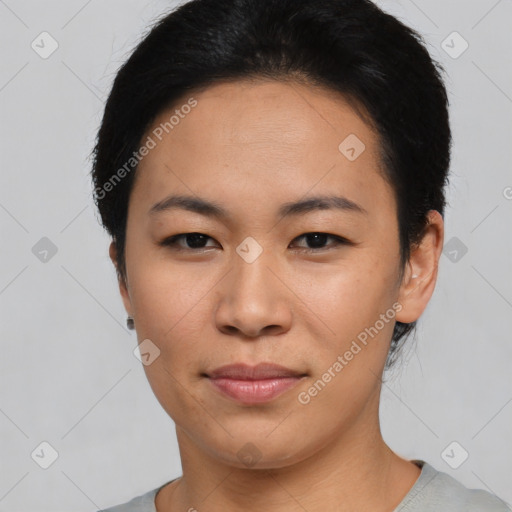 Joyful asian young-adult female with short  black hair and brown eyes