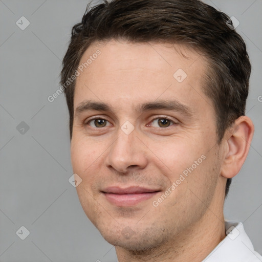 Joyful white young-adult male with short  brown hair and brown eyes