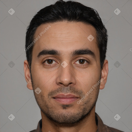 Joyful white young-adult male with short  black hair and brown eyes