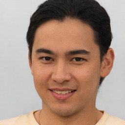 Joyful asian young-adult male with short  brown hair and brown eyes