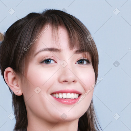 Joyful white young-adult female with long  brown hair and blue eyes