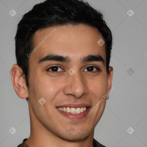 Joyful latino young-adult male with short  brown hair and brown eyes