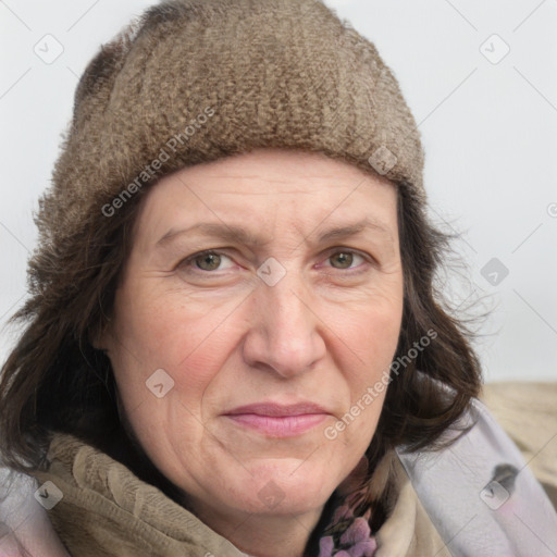 Joyful white adult female with medium  brown hair and grey eyes